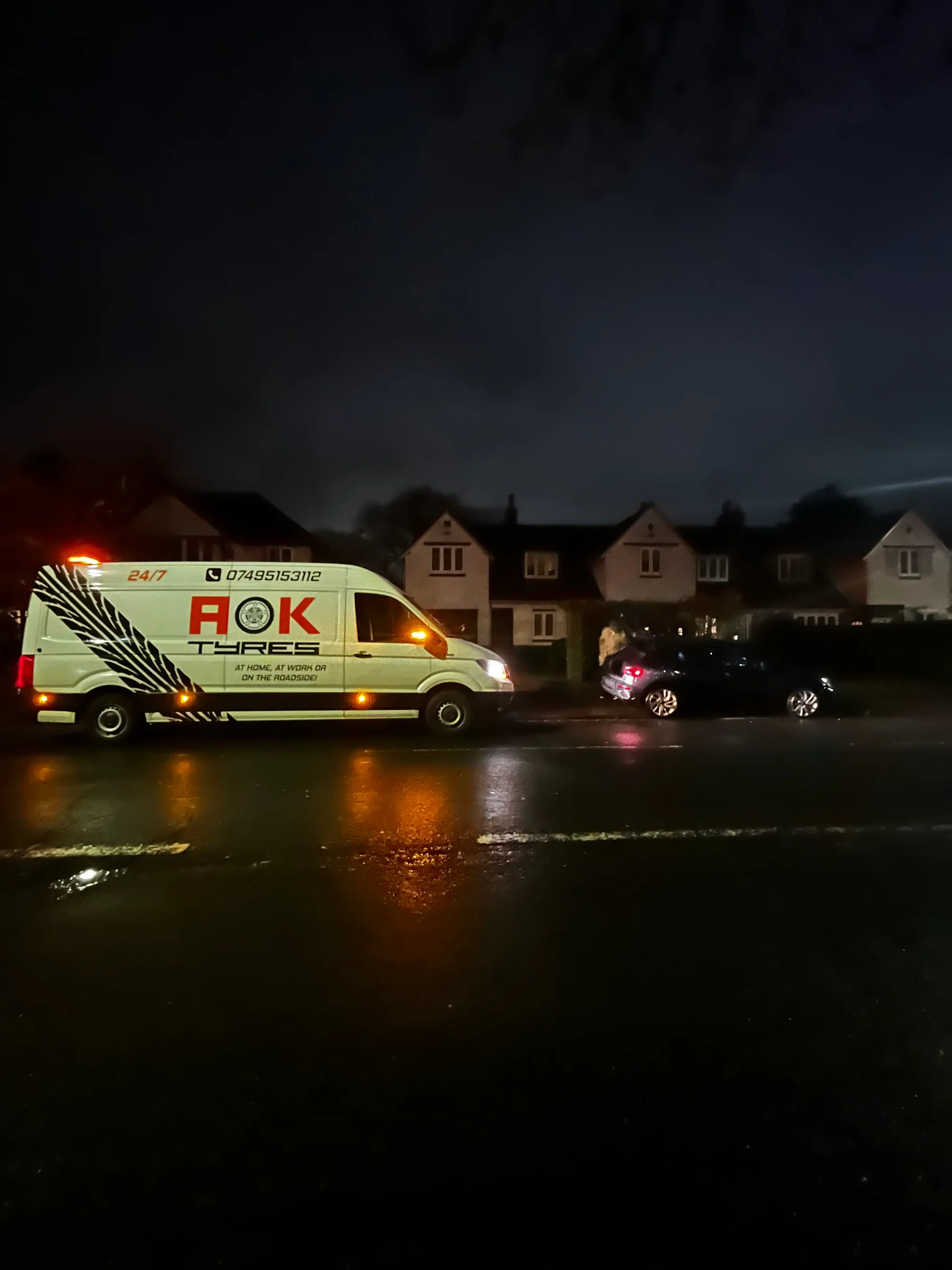 Ford on a driveway with AOK tyre van helping out.