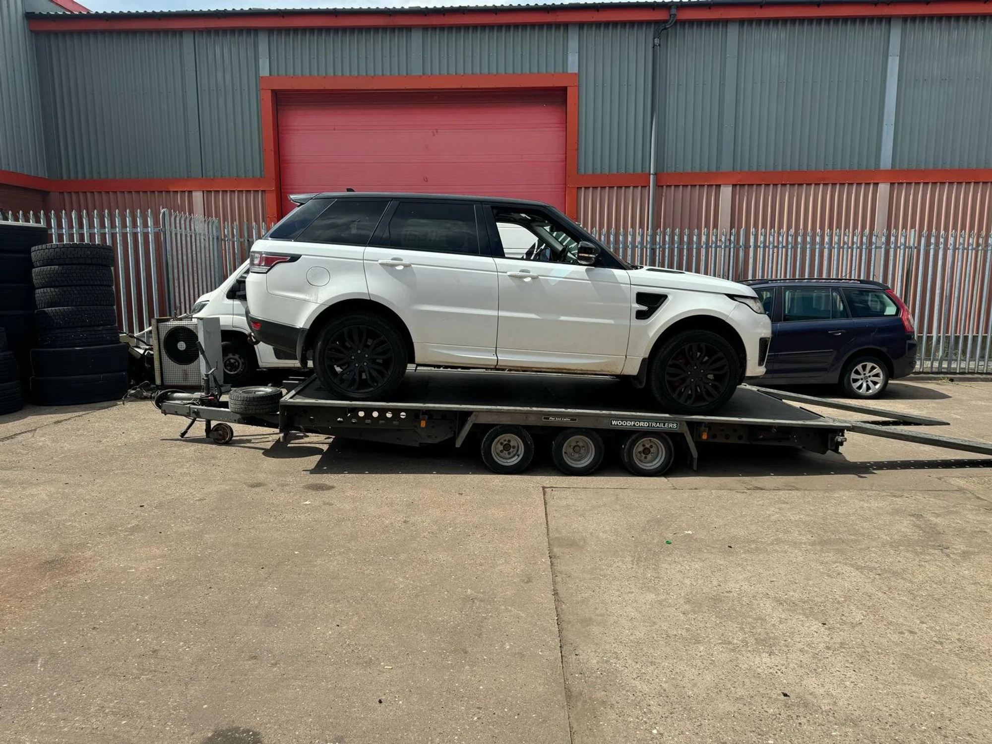 Range rover on a recovery truck bed